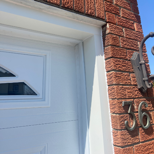 White colour preview on a garage door and siding frame; illustrative finish